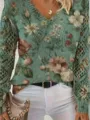 Detailed view of women's bohemian floral print knit sweater featuring V-neck and mesh sleeves - S / Top (VT6)