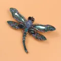 Elegant vintage dragonfly brooch pin featuring vibrant blue crystals and rhinestones - Light Blue