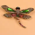 Exquisite vintage dragonfly brooch featuring colorful rhinestones on a gold-plated base - Red and Green