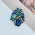 Elegant rhinestone flower basket brooch featuring blue teardrop crystal for suit decoration - Blue