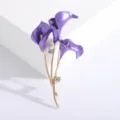 Detail view of a purple enamel calla lily flower brooch with gold finish and crystals - Purple