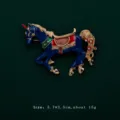 Detailed view of a blue enamel carousel horse brooch with gold accents and sparkling crystals. - Horse Style (V2)