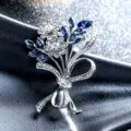 Elegant silver flower bouquet brooch with sparkling blue and clear rhinestones - Dark Blue Rhinestone Style / Silver