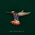 Detail shot of a vibrant colorful enamel hummingbird brooch featuring size and weight specifications - Green Hummingbird Style (V13)