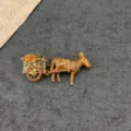 Vintage enamel donkey cart brooch featuring yellow crystal accents on a dark stone surface - Donkey And Cart Style