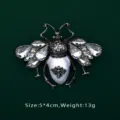 Detail shot of a vintage Baroque bee brooch with faceted crystals and white center - Bee Beetle Design (BK02)