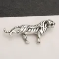 Close-up detail of vintage silver tiger brooch embellished with sparkling rhinestones - Antique Silver Tiger Striped Inlaid
