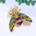 Prachtige keverbroche met kleurrijk emaille en sprankelende kristallen in goud. - Keverstijl (Stijl 11)