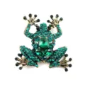 Macro view of a vivid green rhinestone-studded frog brooch pin with golden finish. - Vintage Gold Green Rhinestone Frog Style (A06)