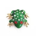 Detailed view of a green enamel frog brooch featuring red gemstone eyes and faux pearls. - Green Enamel Red Eyed Frog Style (A12)