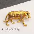 Detailed macro view of a vintage gold-plated tiger brooch with precise measurements - Running Tiger Gold