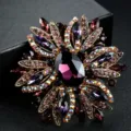 Elegant purple crystal floral brooch with multi-colored stones on a dark background. - Purple Crystal Floral (2)