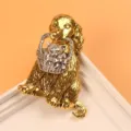 Detailed view of a gold-toned dog brooch holding a silver-toned cat in a basket. - Golden Dog with Silver Cat Basket / Two-tone Gold Silver