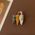 Detailed view of retro style enamel cat trio brooch with sparkling rhinestone eyes - Three Lining Cats Style
