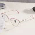 Detailed view of metal cat-eye glasses frame with rhinestones and pink accents - Pink Gold / Photochromic Anti-Blue Light Glasses