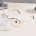 Detail of gold metal cat-eye glasses frame with rhinestone accents and photochromic lenses - Wine Red Frame / Photochromic Anti-Blue Light Glasses
