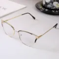 Detail view of trendy cat-eye metal glasses frame with rhinestones and anti-blue light lenses - Photochromic Anti-Blue Light Lens / Black Gold Frame