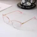 Detail view of stylish cat eye metal glasses frames with rhinestones and pink accents. - Photochromic Anti-Blue Light Lens / Pink Frame
