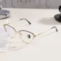 Side view of cat-eye metal glasses frame with rhinestone detail and photochromic lenses - Black Gold Frame / Photochromic Anti-Blue Light Glasses