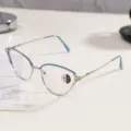 Detailed view of silver cat-eye metal glasses with blue accents and sparkling rhinestones - Blue Silver Frame / Photochromic Anti-Blue Light Glasses