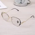 Detailed view of stylish gold metal eyeglass frames with photochromic lenses - Black Gold Frame / Photochromic Anti-Blue Light
