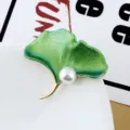 Elegant ginkgo leaf brooch with green enamel, pearl accent, and gold-tone alloy pin - Green