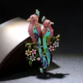 Elegant enamel bird brooch featuring two pink rhinestone-studded birds on a branch - Pink