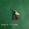 Detailed macro view of a colorful vintage enamel angel brooch playing a gold trumpet - Blowing Horn Angel Style (B10)