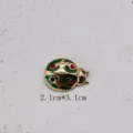 Detailed view of vintage ladybug brooch with green enamel and red rhinestones, size 2.1x3.1cm - Vintage Gold Base Ladybug Shaped Style (BK13)