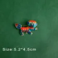 Close-up of vintage enamel mythical creature brooch with intricate colorful patterns - Enamel Mythical Beast Style (B9)
