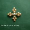 Elegant vintage baroque style cross brooch inlaid with white pearls on a green textured surface - Pearl Cross Style (B11)