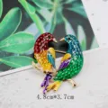 Close-up of vintage enamel bird brooch with 4.8cm by 3.7cm dimensions. - Two Birds Facing Each Other on Gold Branch Style (BK14)