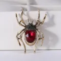 Vintage spider brooch in antique gold with large red crystal center and dark accents. - Antique Gold Red Gem Style (SP08)