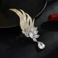 Elegant gold-tone crystal floral brooch featuring marquise stones and a pear-cut drop - Gold Wings Crystal Pendant