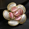 Elegant vintage flower brooch with pink and white cat-eye stones in a gold setting - Pink and White Cat Eye Flower