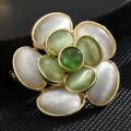 Elegant vintage flower brooch with green and white cat's eye stones in gold finish - Gradient Cat Eye Vintage Flower