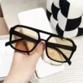 Lightweight black TR aviator sunglasses with amber lenses providing UV protection - Black Frame Tea Lens