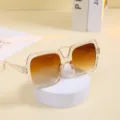 Oversized square sunglasses for women with transparent amber frames and gradient lenses. - Champagne Frame Gradient Brown Lens