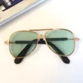 Close-up of gold-framed pet aviator sunglasses with green lenses for cats and dogs - Aviator Glasses - Green Lenses (3026 Pet Collection)