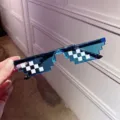 Detail view of blue pixelated mosaic sunglasses for party and photography props. - Double Row Pixel Style / Blue