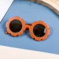 Stylish burnt orange flower-shaped children's sunglasses with dark UV protection lenses - Brown Frame Tea Lens