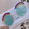 Cute kids round sunglasses with rainbow frames, light blue lenses, and cloud decor - White Frame Green Lens