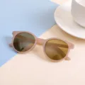 Stylish round frame sunglasses for kids in candy pink, trendy children's eyewear - Brown