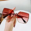 Elegante quadratische randlose Sonnenbrille mit rot-braunem Verlaufsglas und Gold - Goldrahmen Farbverlauf Rot
