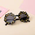 Sunflower-shaped children's sunglasses featuring black frames and bright yellow accents. - Black Frame Sunflower
