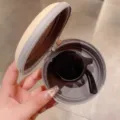 Faltbare Kinder-Rundsonnenbrille in Schwarz mit cremefarbenem Etui in Bonbonfarbe - Schwarz