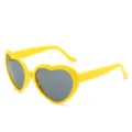 Gafas de sol de corazón amarillo vibrante con lentes grises para un estilo de moda único - Amarillo