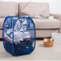 Blue mesh collapsible laundry basket for dirty clothes and toy storage in a cozy home setting. - 30.30.46 / Dark Blue