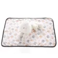 Pet fleece blanket detail showing soft paw print fabric texture, cozy dog and cat resting mat. - Off White