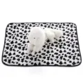 Soft plush pet blanket with black and white cow print, cozy fleece mat for dogs and cats. - Cow Print